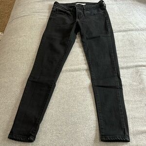 Levi’s 711 black skinny jeans, size 24